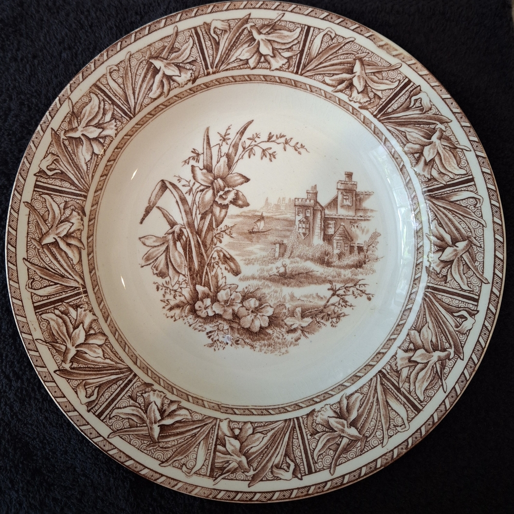 W.H. Grindley & Co. "Daffodil" pattern brown transferware plates.
